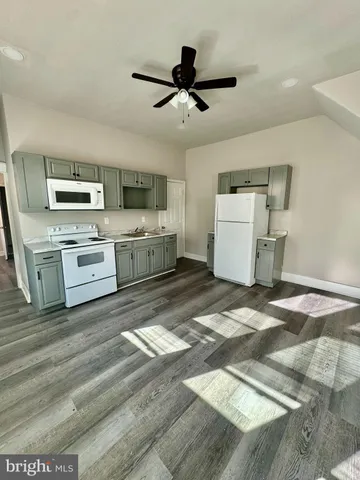 a kitchen with a stove oven and a sink