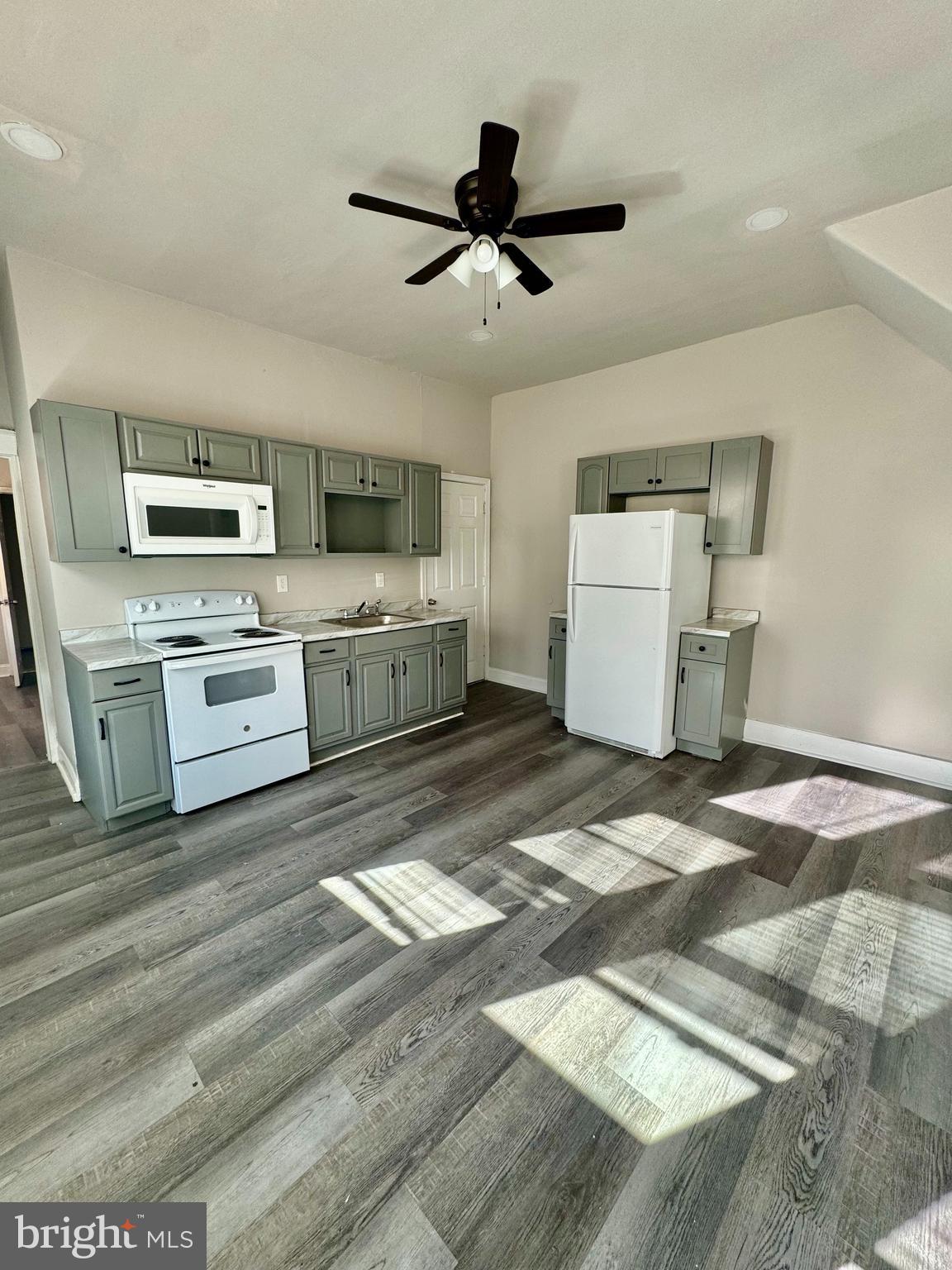 4818 North 13th Street, Unit 1 Philadelphia, PA 19141 - Photo 3 of 12 a kitchen with a stove oven and a sink