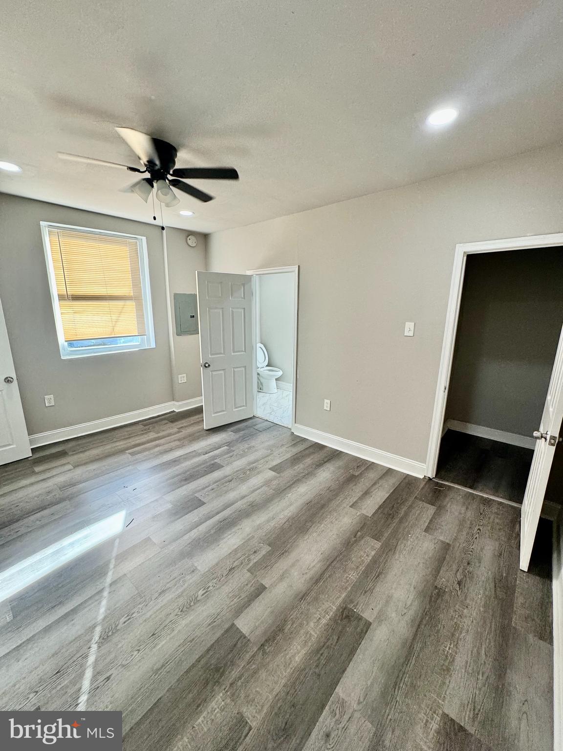 4818 North 13th Street, Unit 1 Philadelphia, PA 19141 - Photo 4 of 12 a view of empty room with wooden floor and fan