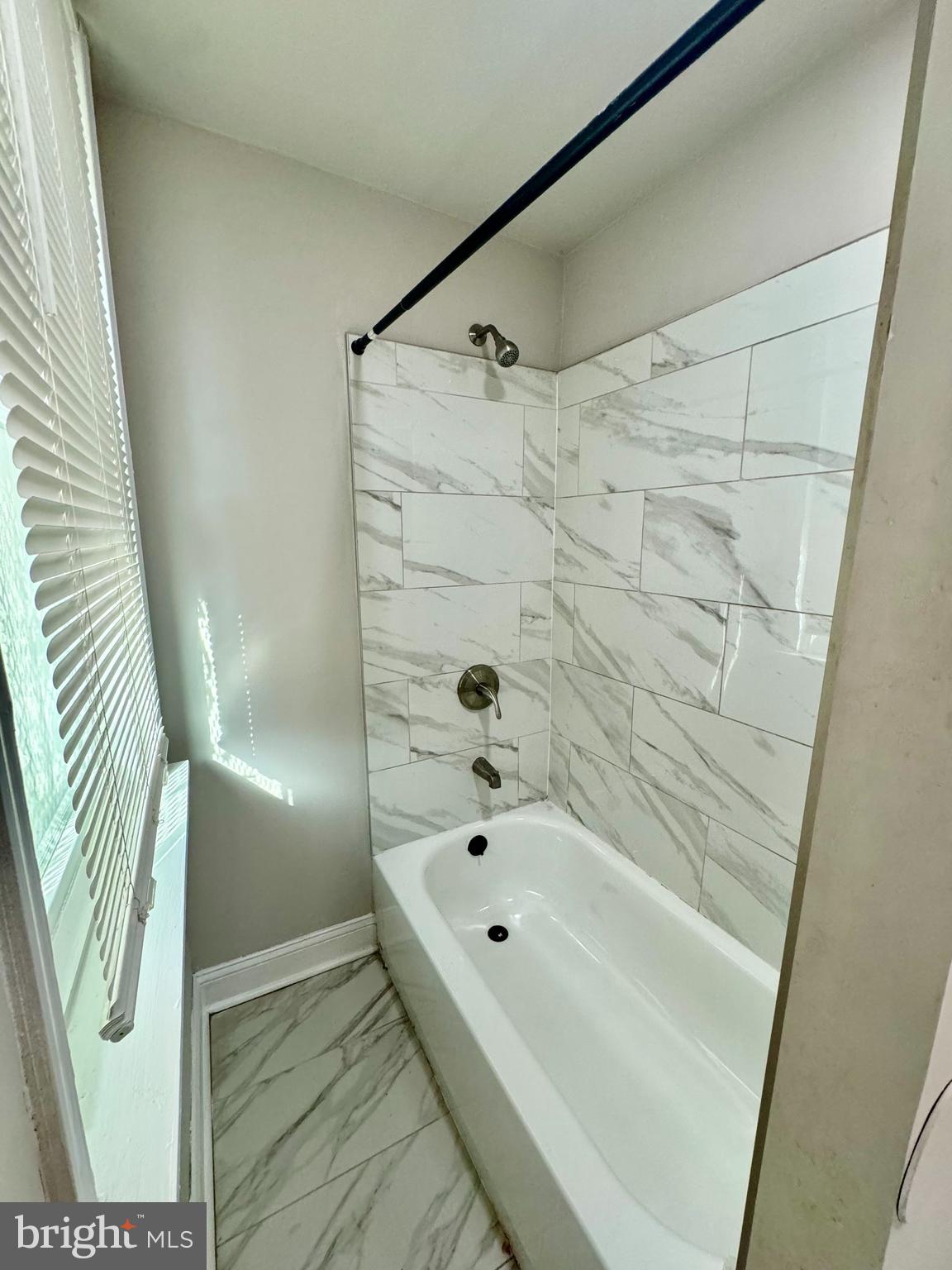 4818 North 13th Street, Unit 1 Philadelphia, PA 19141 - Photo 6 of 12 a bathroom with a bathtub