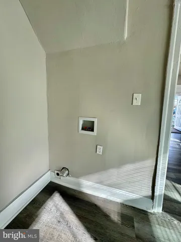 a view of a room with rack and wooden floor