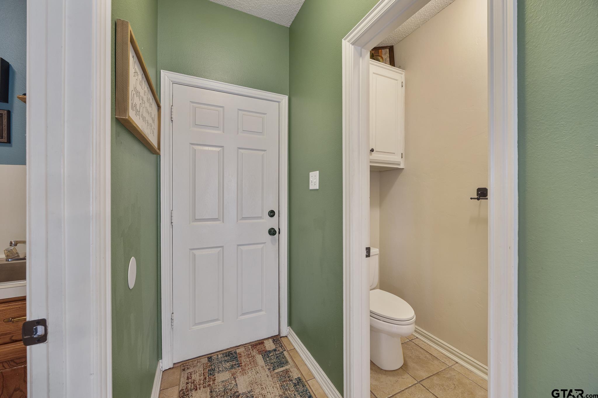 18344 Springmill Court Flint, TX 75762 - Photo 21 of 45 a bathroom with a toilet and a shower