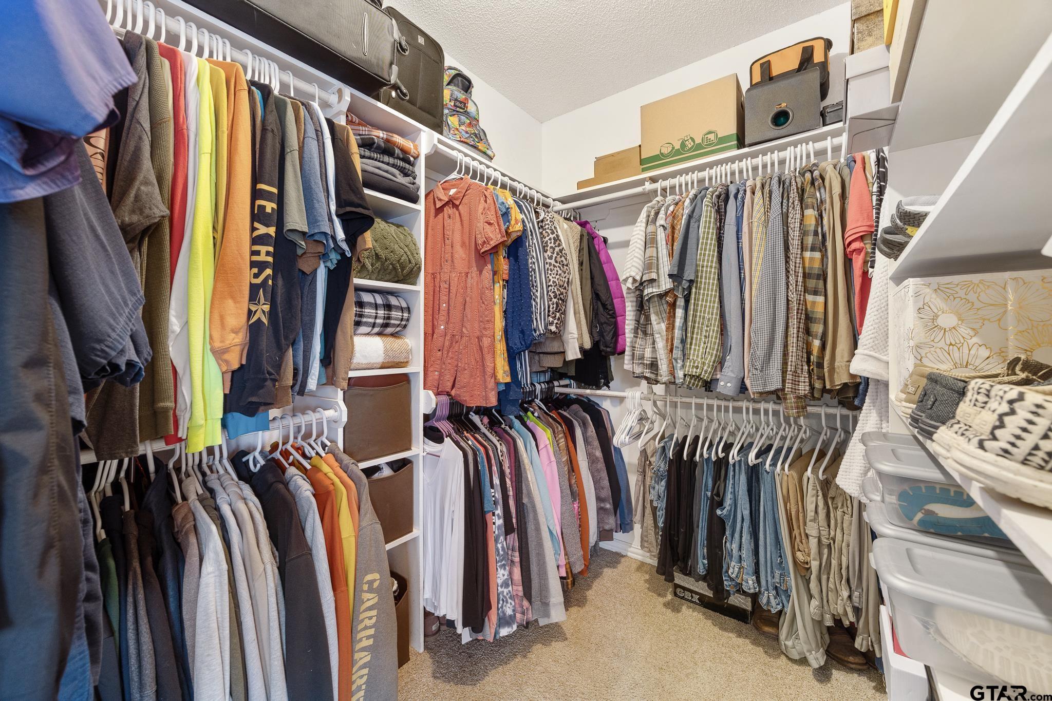 18344 Springmill Court Flint, TX 75762 - Photo 28 of 45 a view of walk in closet with clothes