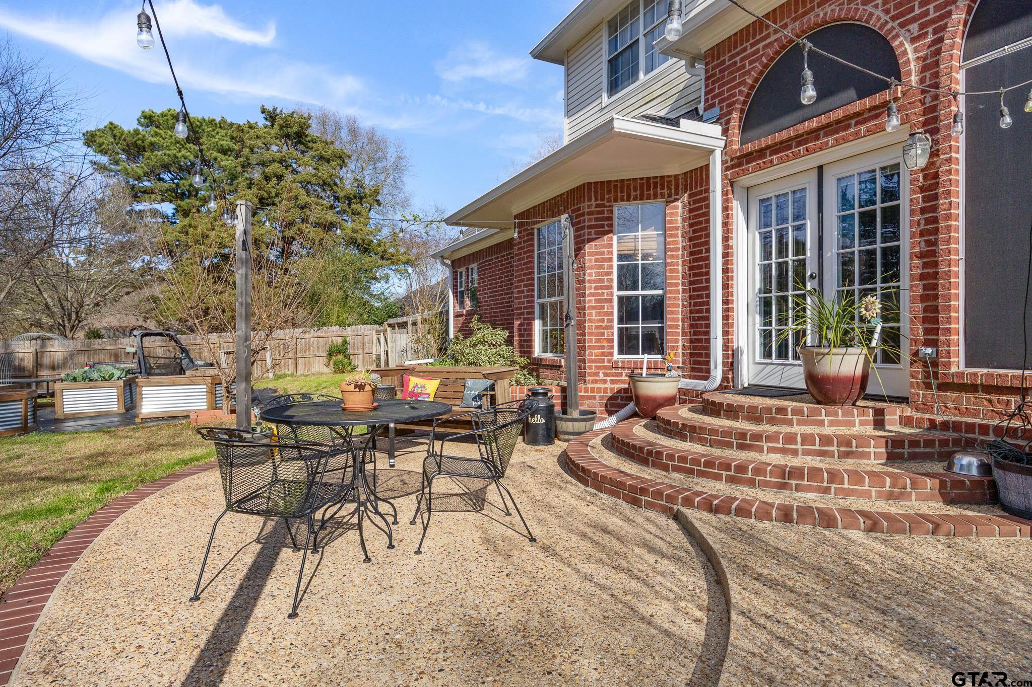 18344 Springmill Court Flint, TX 75762 - Photo 33 of 45 a view of a house with backyard porch and patio