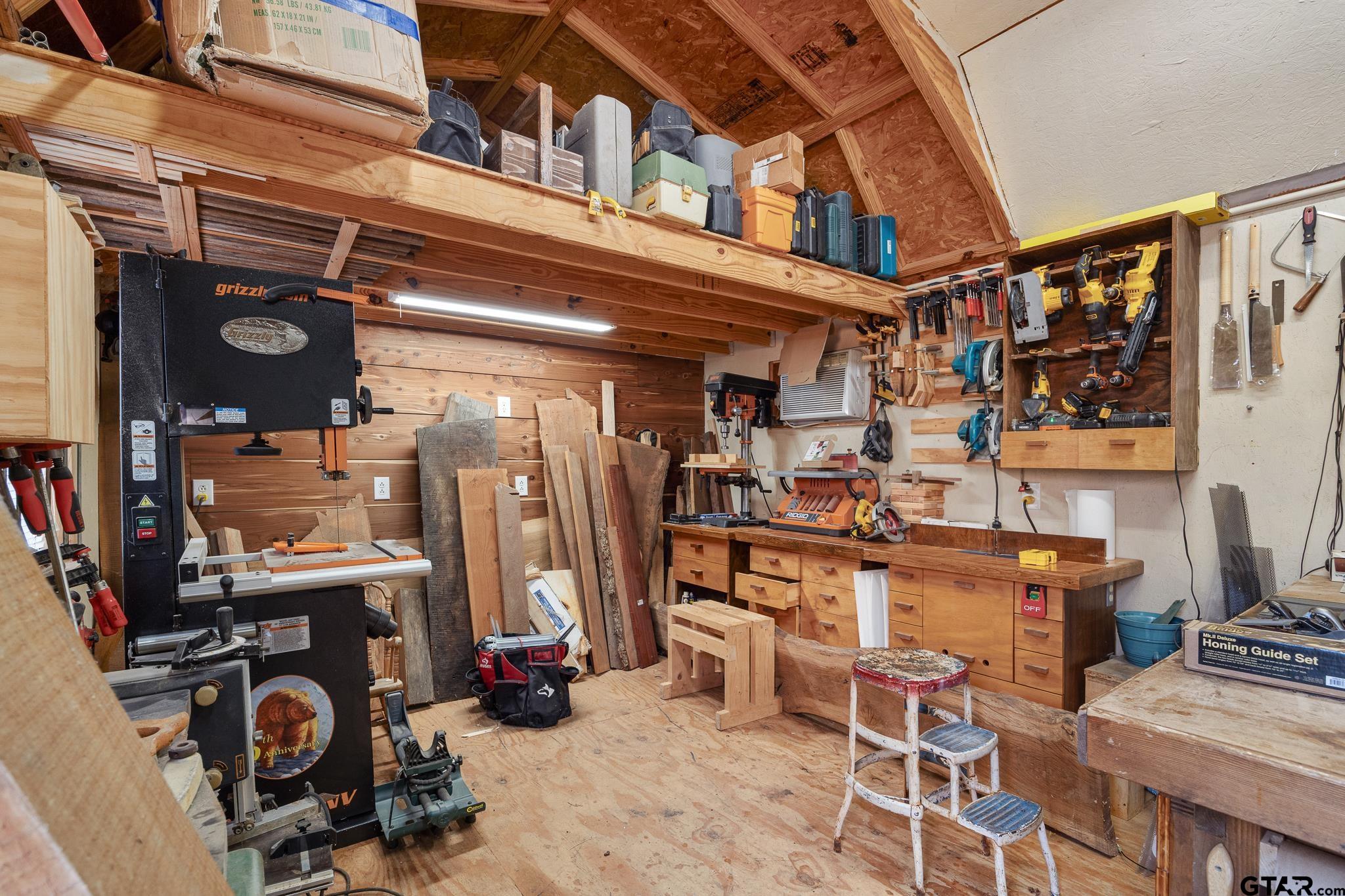18344 Springmill Court Flint, TX 75762 - Photo 38 of 45 a view of walk in closet with clothes and shoes
