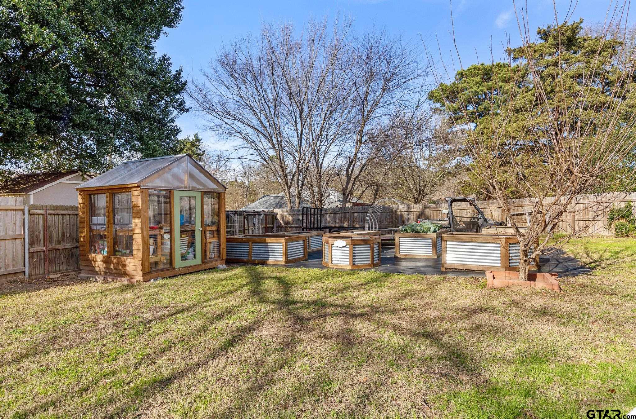 18344 Springmill Court Flint, TX 75762 - Photo 41 of 45 a view of a house with large trees and a big yard