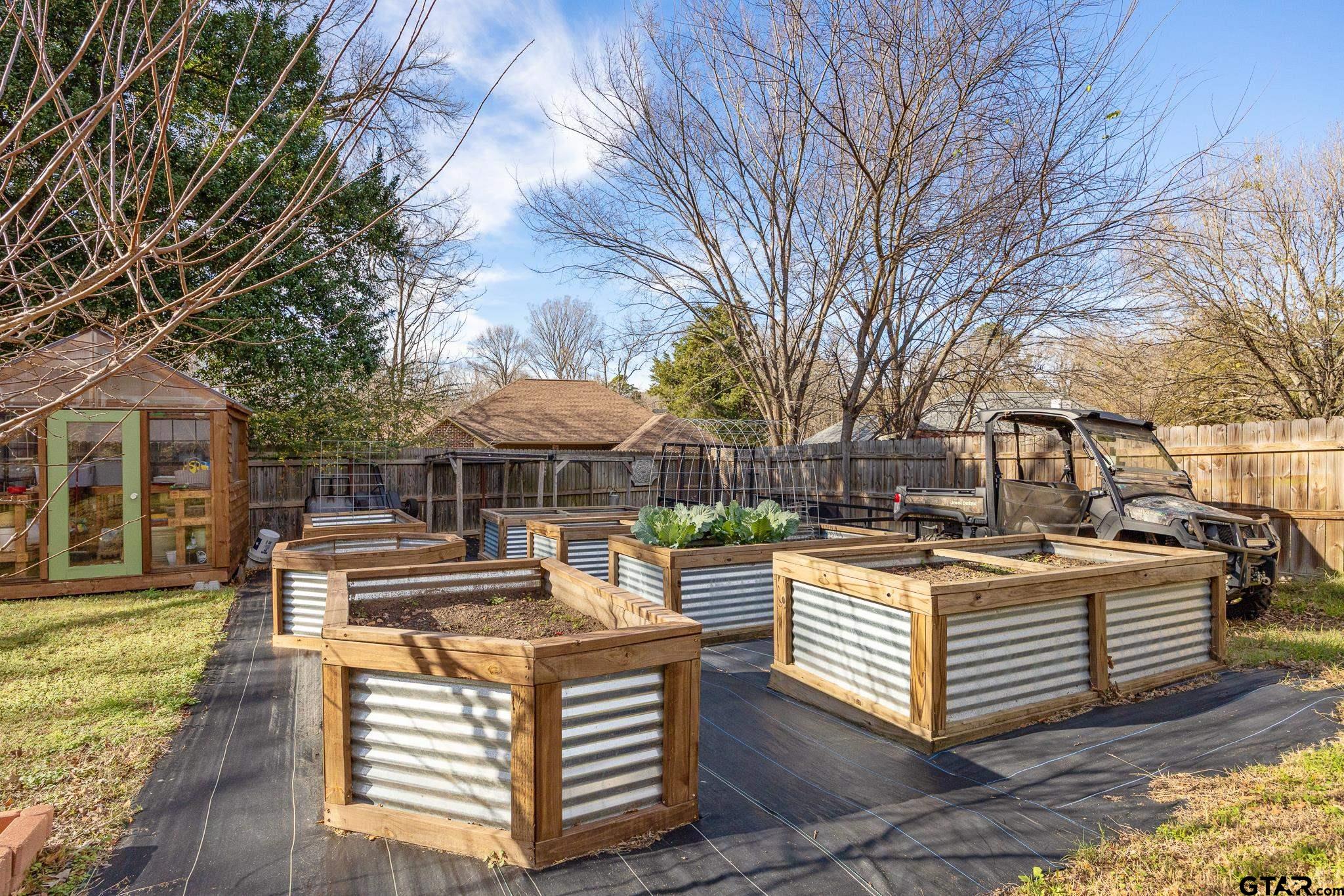 18344 Springmill Court Flint, TX 75762 - Photo 43 of 45 a view of a white house with a big yard and large trees