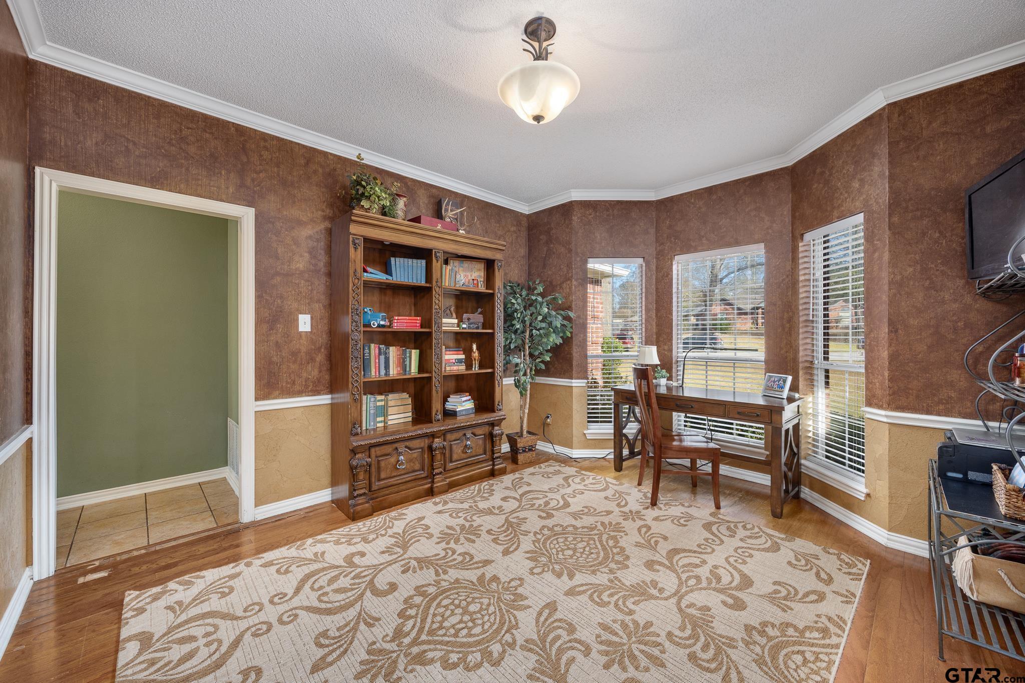 18344 Springmill Court Flint, TX 75762 - Photo 7 of 45 a living room with furniture a rug and a flat screen tv