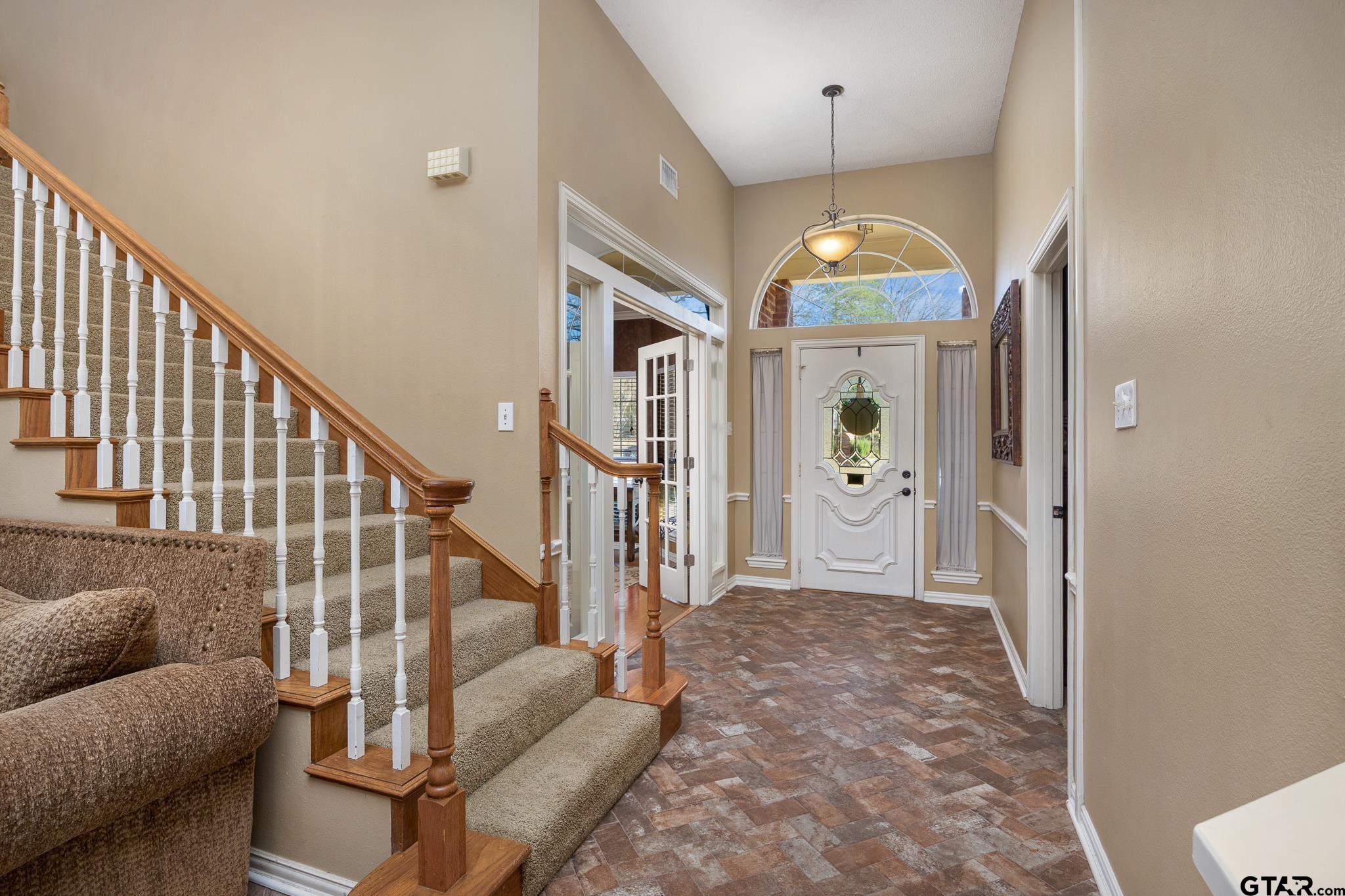 18344 Springmill Court Flint, TX 75762 - Photo 9 of 45 a living room with furniture and a chandelier
