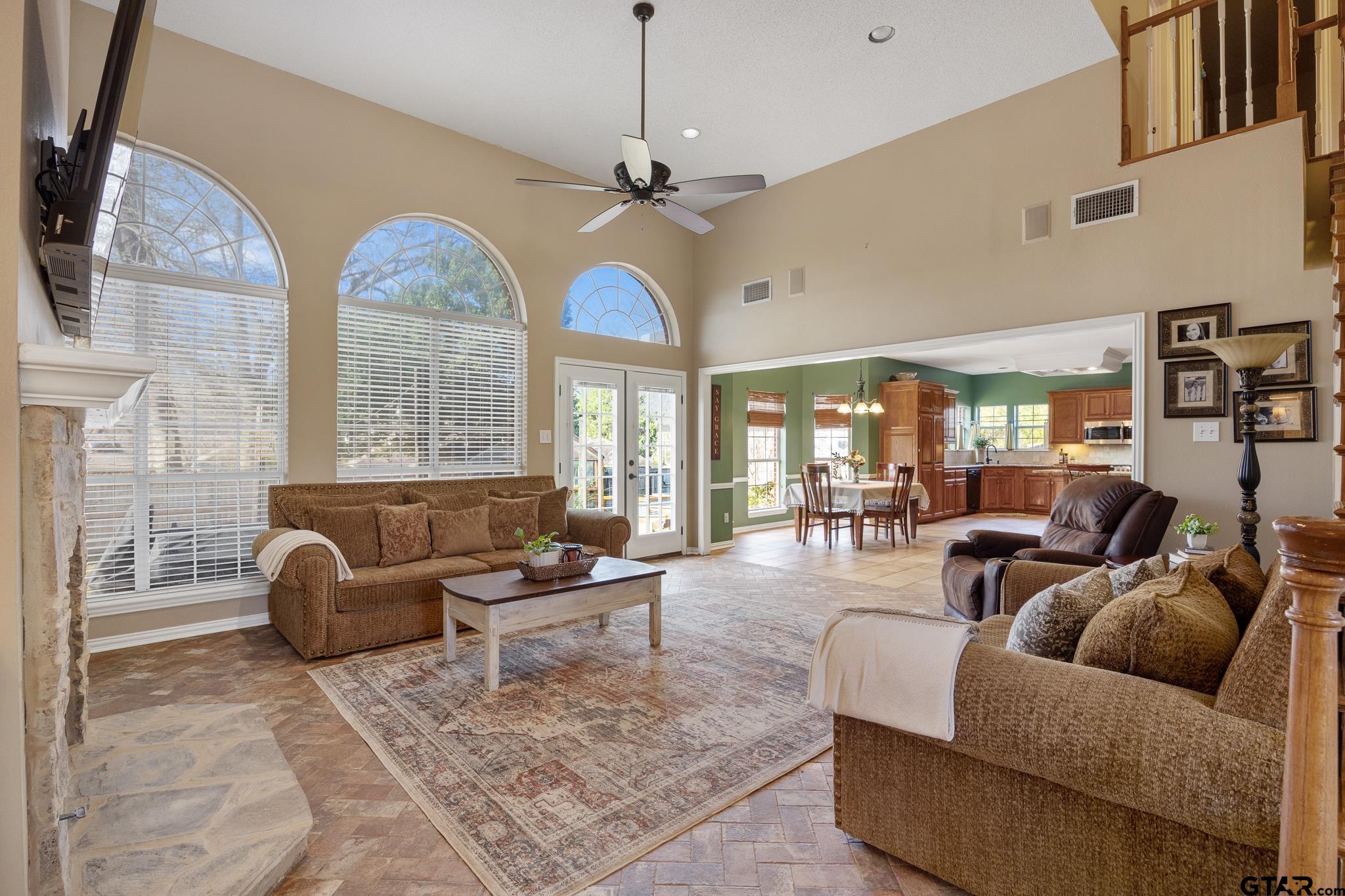 18344 Springmill Court Flint, TX 75762 - Photo 10 of 45 a living room with furniture a chandelier and a large window