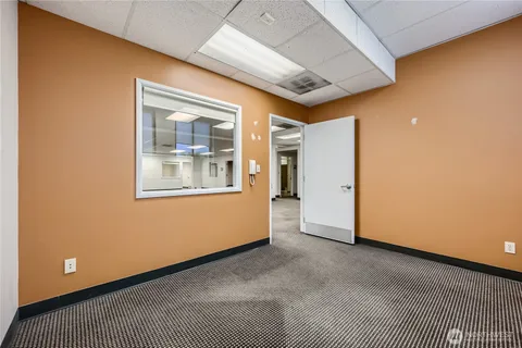 a view of an empty room with a window