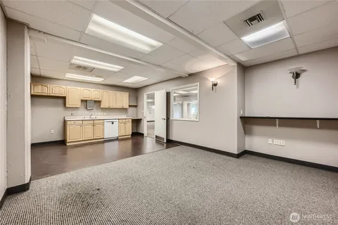 a view of a kitchen with a sink and an oven