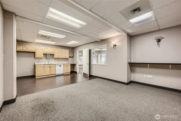 a view of a kitchen with a sink and an oven