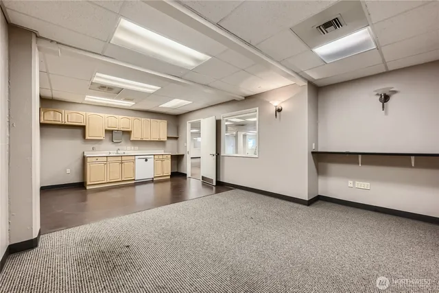 a view of a kitchen with a sink and an oven