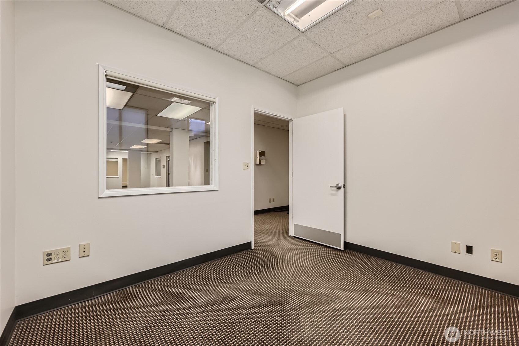 4220 Aurora Avenue North Seattle, WA 98103 - Photo 9 of 18 a view of an empty room with a window