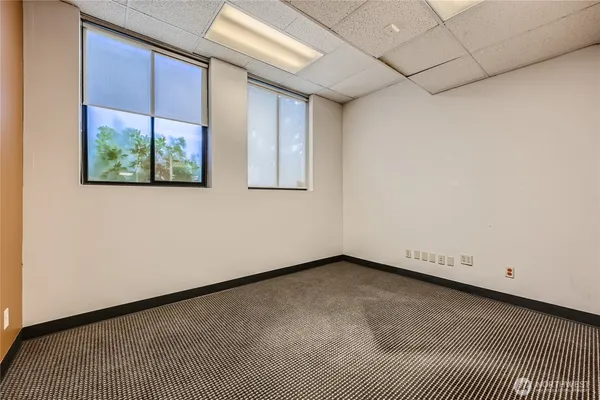 a view of an empty room with a window