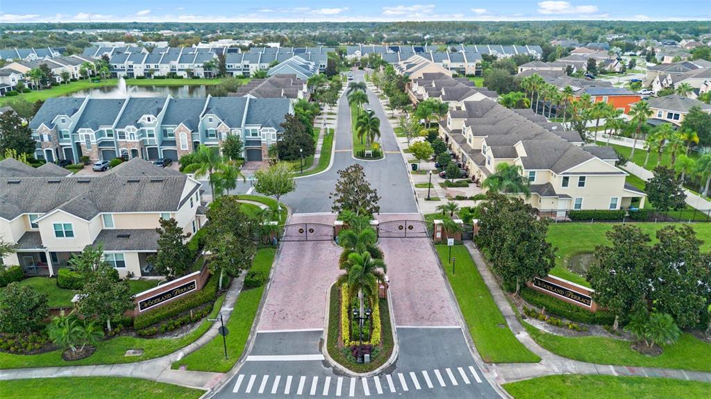 551 Terrace Spring Drive Orlando, FL 32828 - Photo 34 of 41 an aerial view of multiple houses with yard