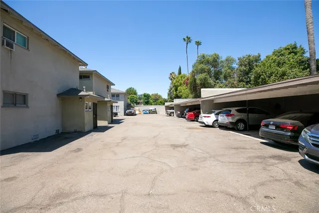 a view of street with parked cars