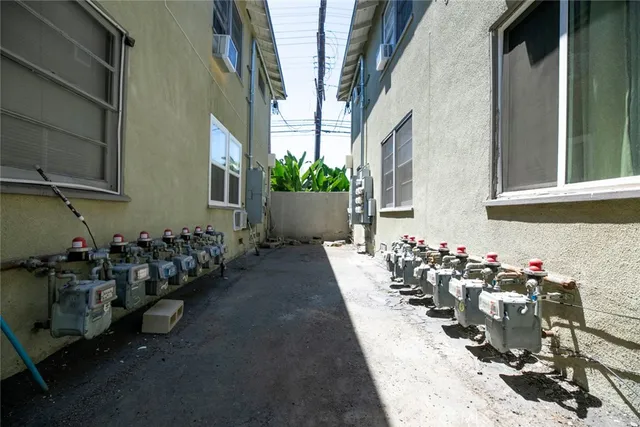 a view of a chairs and a table in the balcony