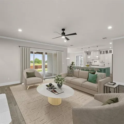 a bedroom with a large bed and a ceiling fan