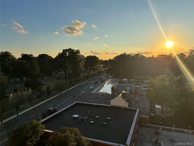 a view of front door with wooden floor and a window