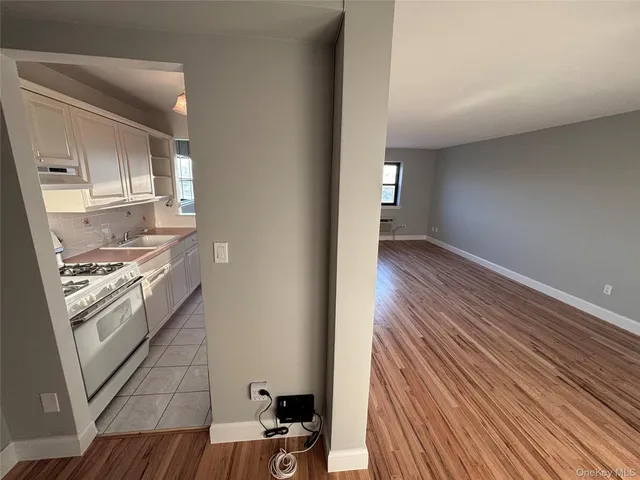a bedroom with a bed and cabinets