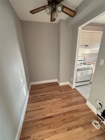a view of a hallway view with wooden floor and staircase