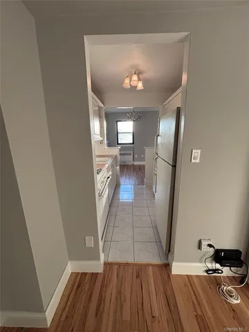 a kitchen with granite countertop a stove sink and cabinets