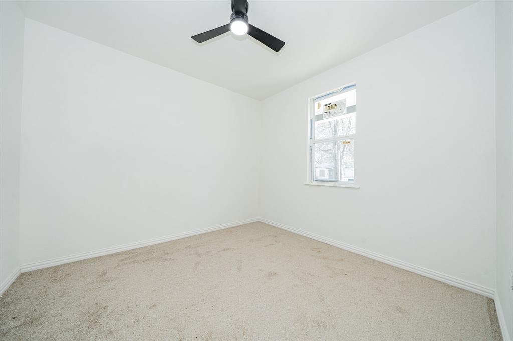 373 5th Street Northwest Paris, TX 75460 - Photo 11 of 16 an empty room with windows