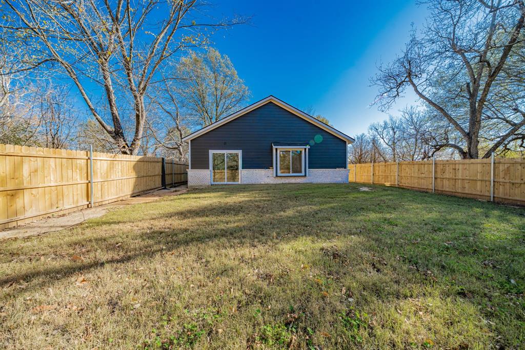 373 5th Street Northwest Paris, TX 75460 - Photo 14 of 16 a view of a house with a yard