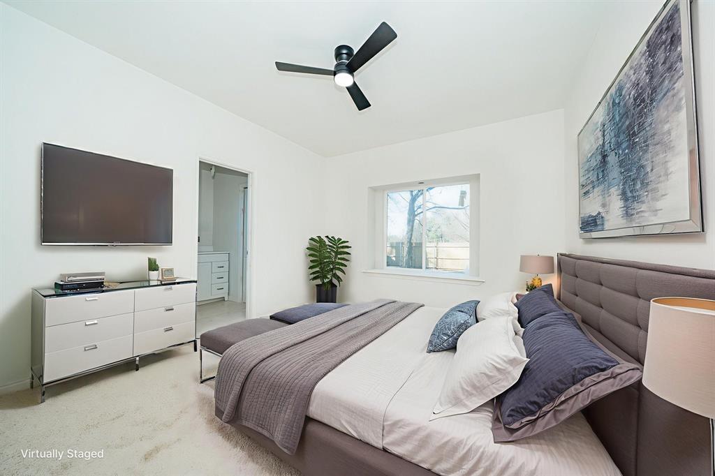 373 5th Street Northwest Paris, TX 75460 - Photo 7 of 16 a bedroom with a bed and a flat screen tv