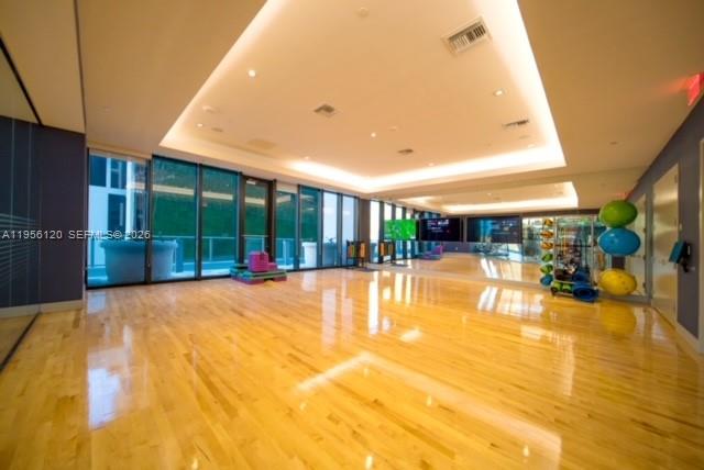 1010 Brickell Avenue, Unit 1510 Miami, FL 33131 - Photo 28 of 32 a swimming pool with outdoor seating and a garden