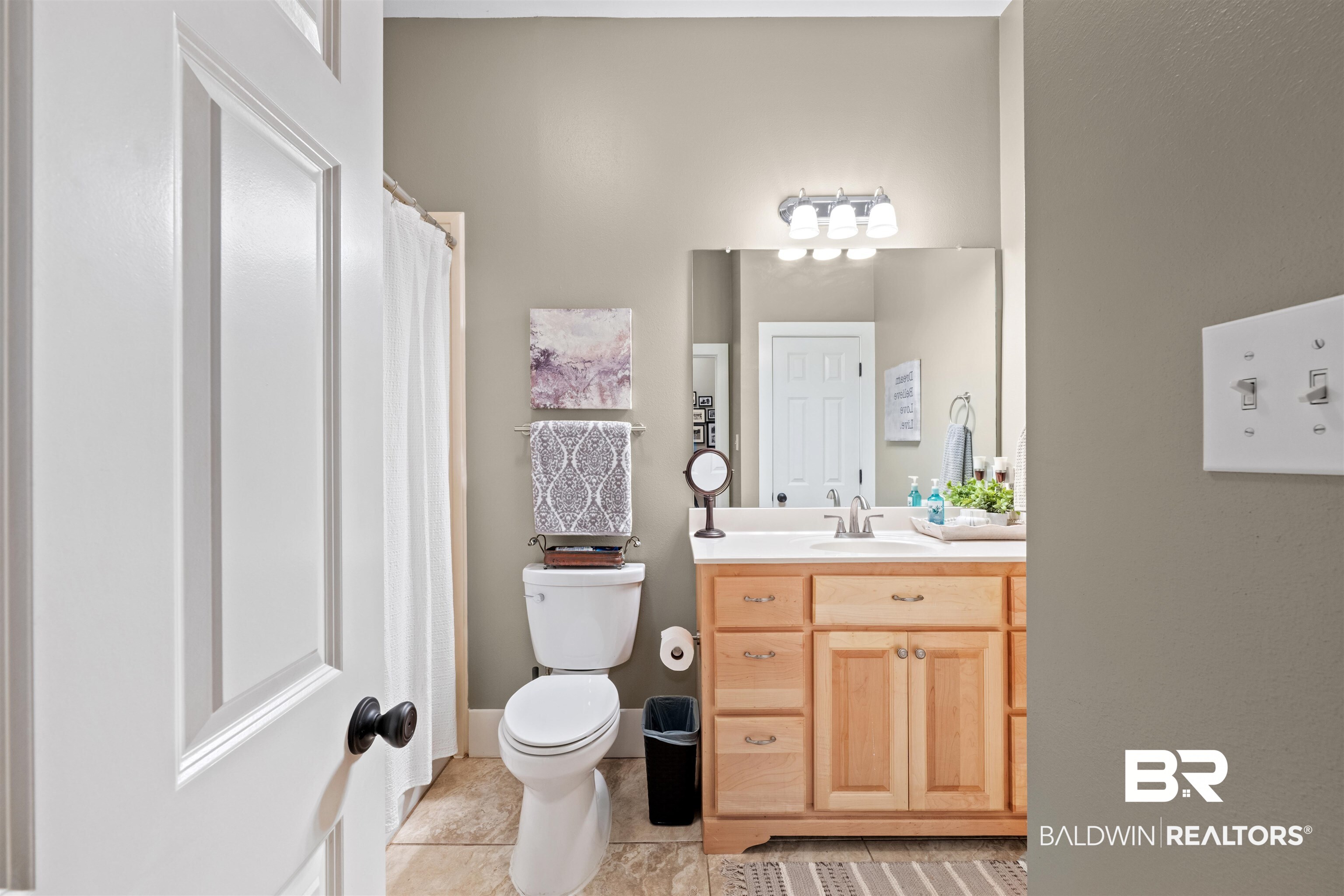 32700 Steelwood Ridge Road, Unit D Loxley, AL 36551 - Photo 19 of 41 Bathroom featuring a light wood-finish vanity with a white countertop and integrated sink