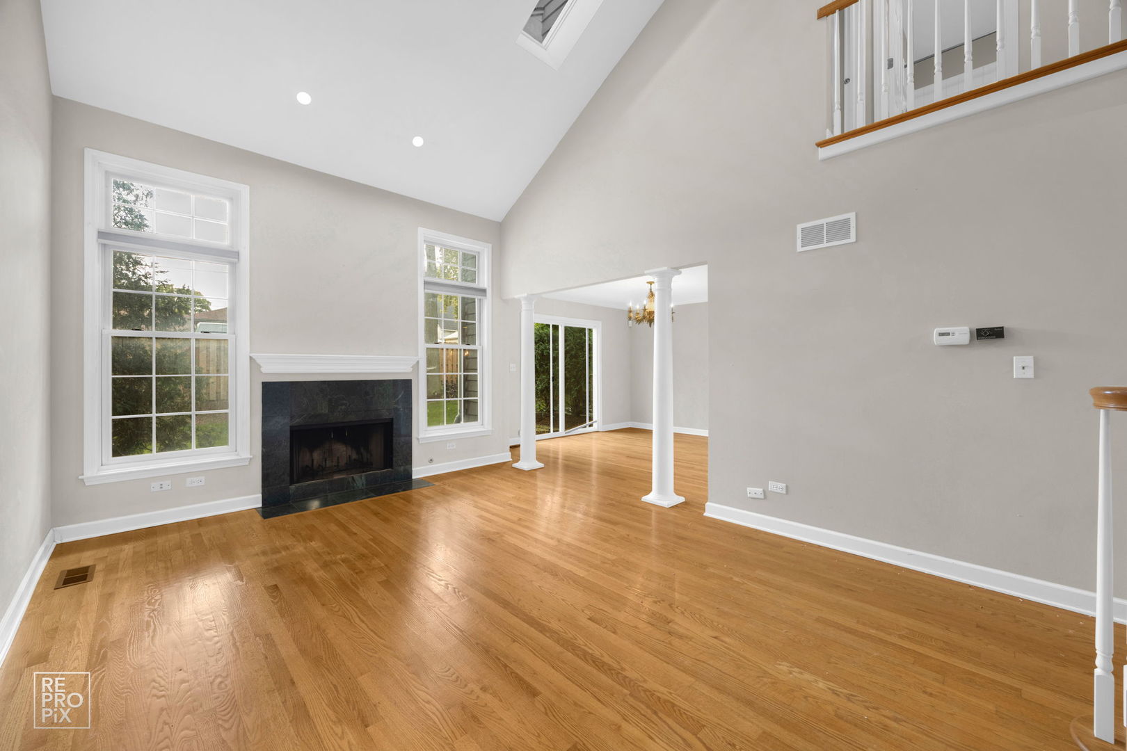 536 West Evergreen Street Wheaton, IL 60187 - Photo 5 of 17 a view of empty room with wooden floor and fireplace