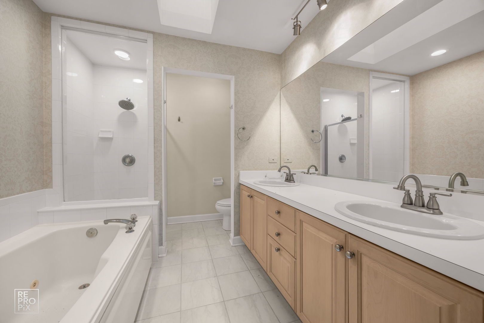 536 West Evergreen Street Wheaton, IL 60187 - Photo 9 of 17 a bathroom with a double vanity sink mirror double and bathtub