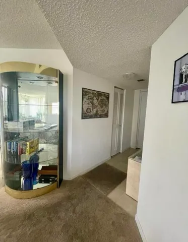 a view of an empty room and glass door