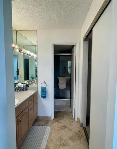 a bed sitting in a bedroom and a table