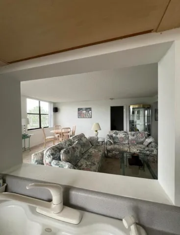 a kitchen with stainless steel appliances granite countertop white cabinets a sink and dishwasher