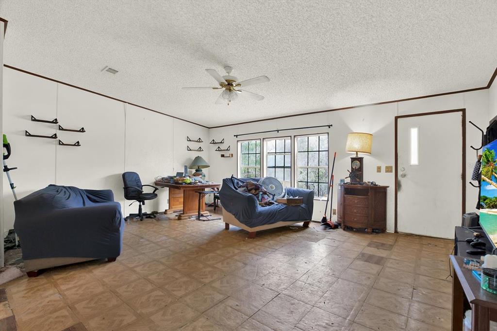 14018 Hexam Road Brooksville, FL 34613 - Photo 5 of 17 a living room with furniture and a window