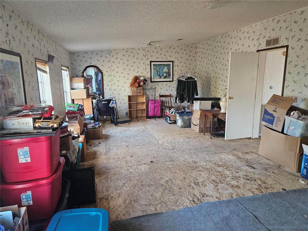 14018 Hexam Road Brooksville, FL 34613 - Photo 8 of 17 a living room with furniture and a flat screen tv