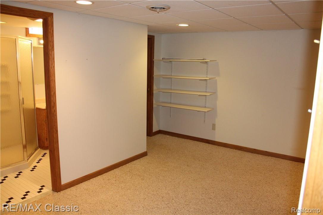 42566 Park Ridge Road Novi, MI 48375 - Photo 18 of 20 More basement shelving and rec room