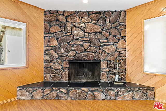 a living room with a couch and a fireplace