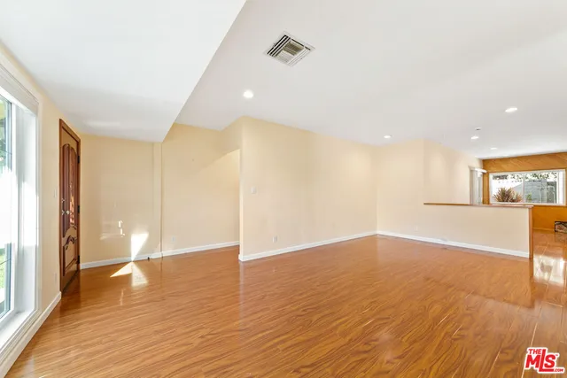 a view of a livingroom with wooden floor