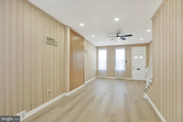 a view of a livingroom with wooden floor