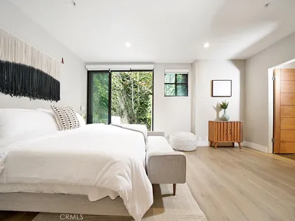 a bedroom with bed and a window