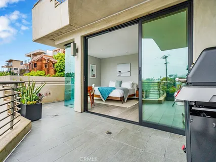 a view of living room filled with furniture and a potted plant