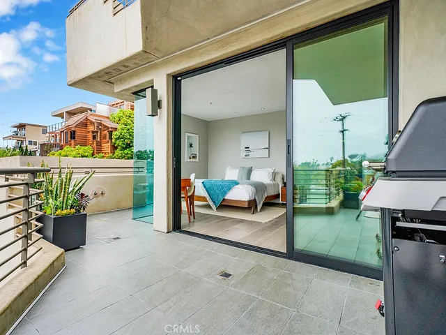 a view of living room filled with furniture and a potted plant