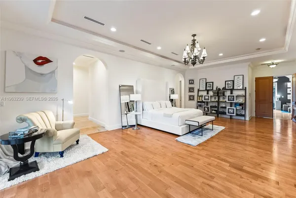 a living room with furniture a rug and a book shelf