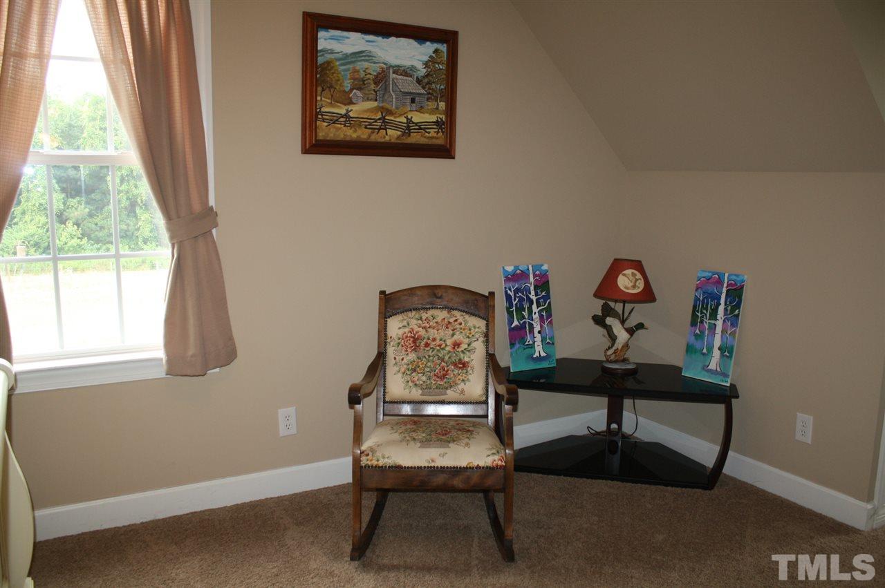 385 Huford Harris Road Spring Hope, NC 27882 - Photo 17 of 25 Your guests will rest well in this lovely upstairs bedroom which is tastefully decorated and ready for your furnishings.