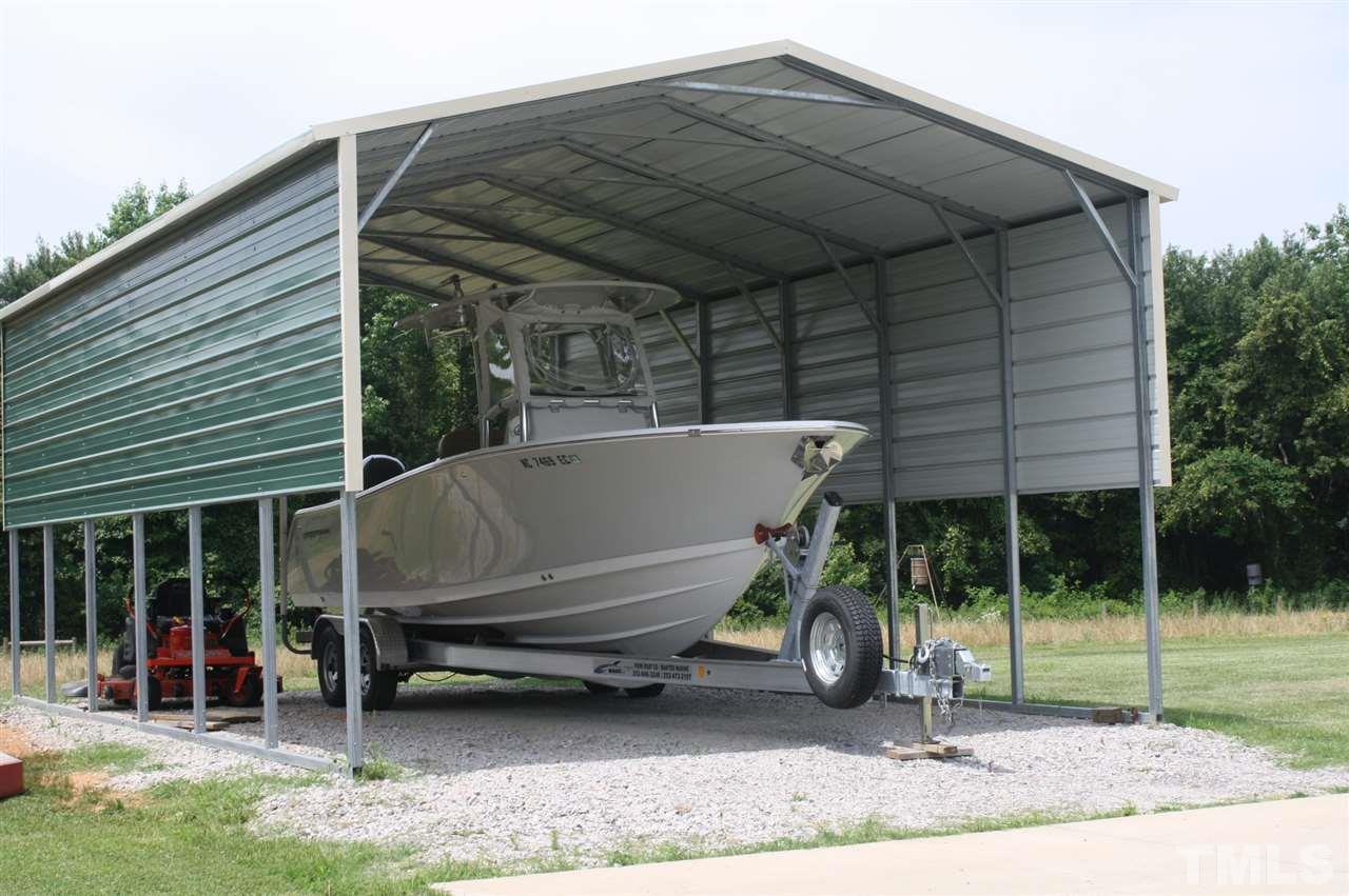 385 Huford Harris Road Spring Hope, NC 27882 - Photo 20 of 25 This large and tall metal carport is the perfect place to storage your boat or RV to protect it from the weather.